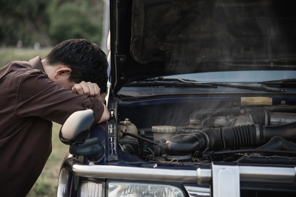 Toyota wrecker checking reusable Toyota parts in a local wrecking yard