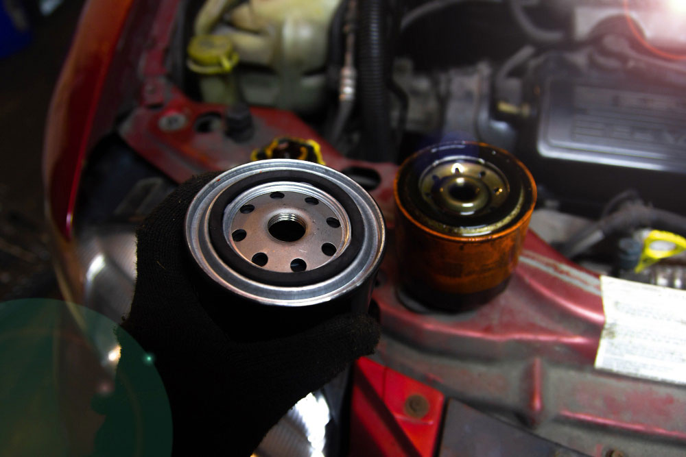 Toyota owner discussing a replacement part and fitting estimate at a workshop counter
